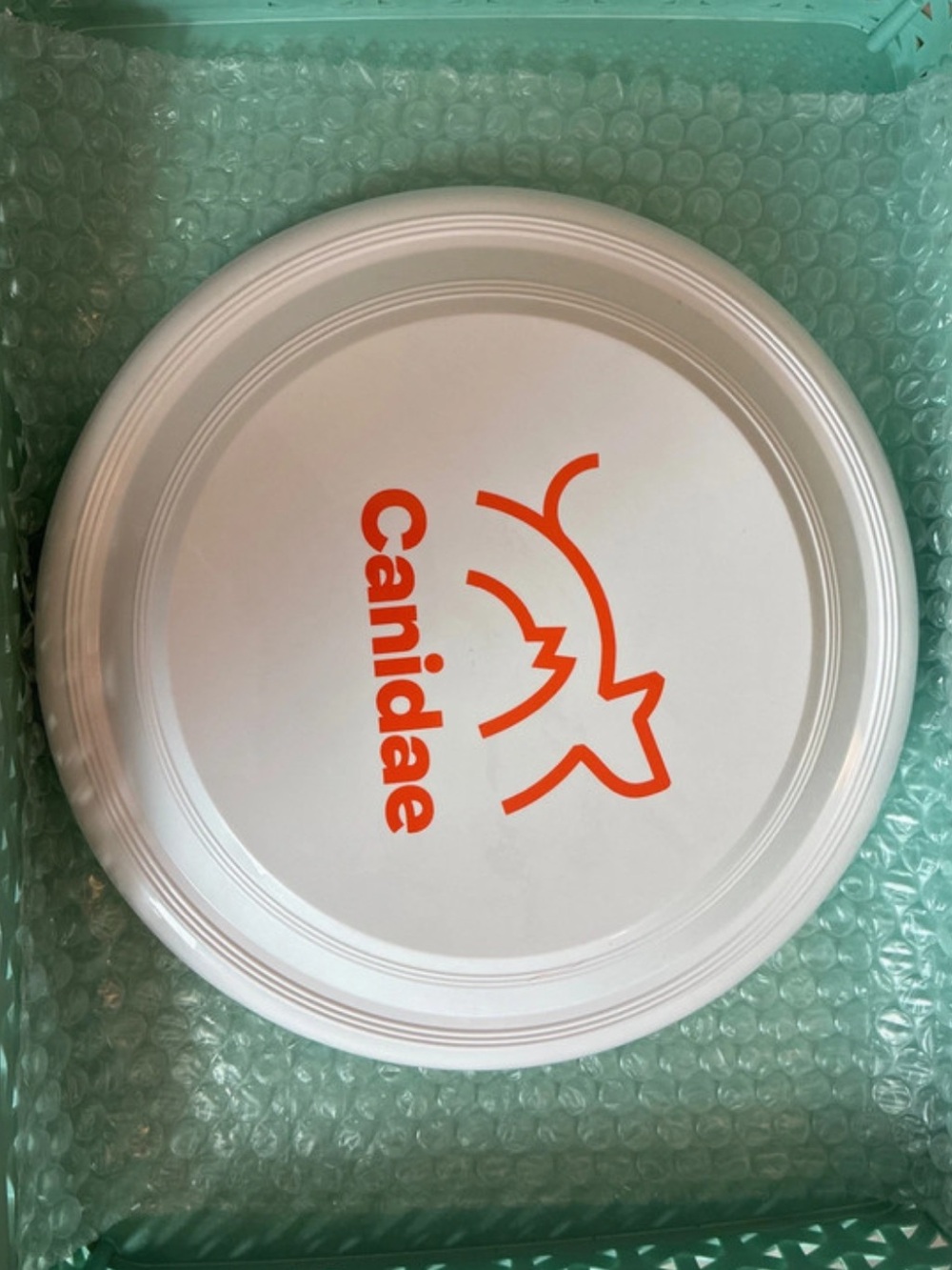 Frisbee Throwing Disc Toy White Orange Canidae Logo